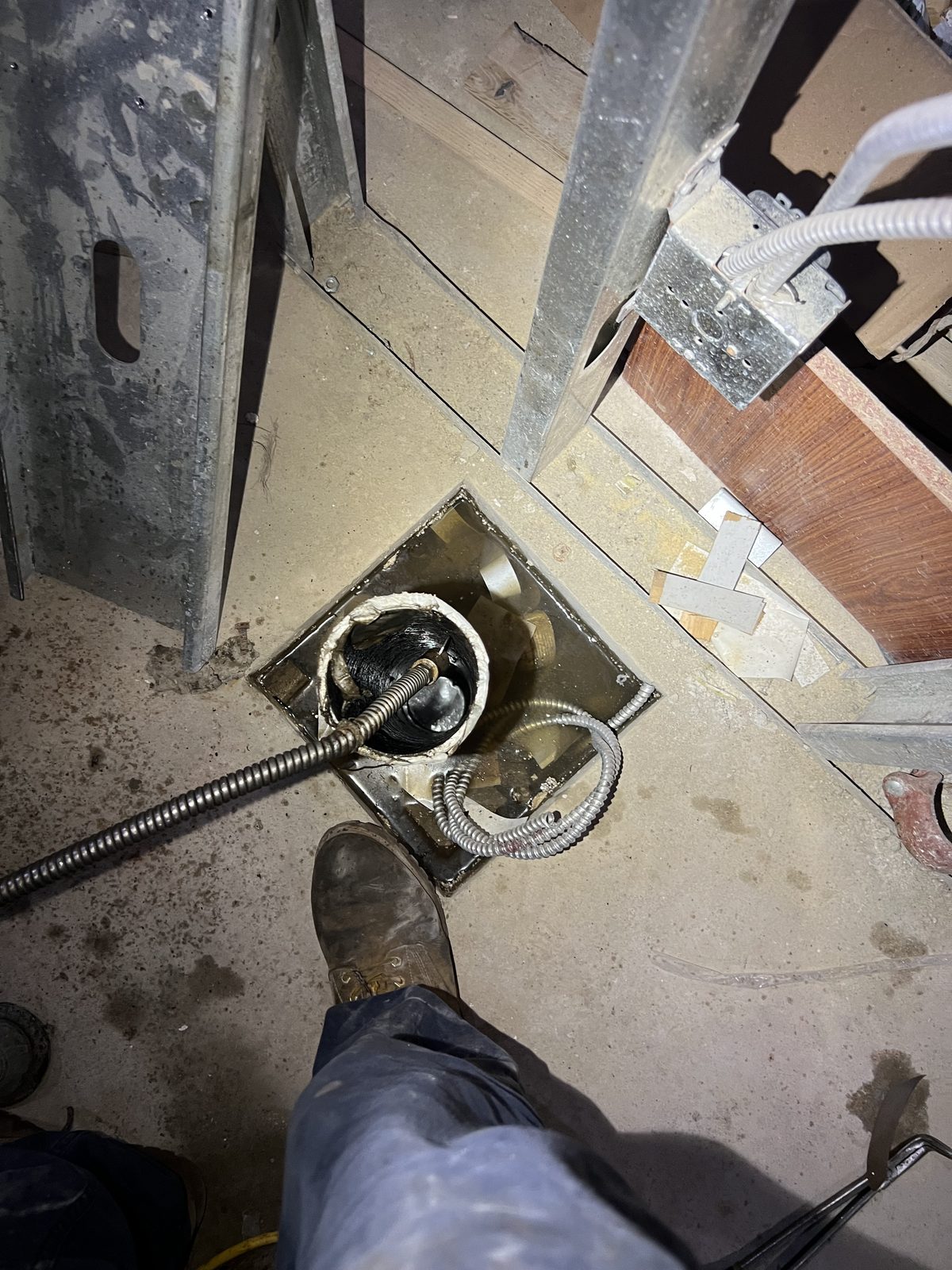 Cable fed through a floor cleanout in a pre-war New York building.